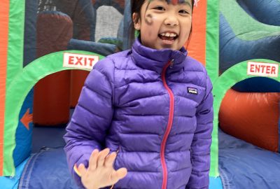 Camper smiling with face paint on